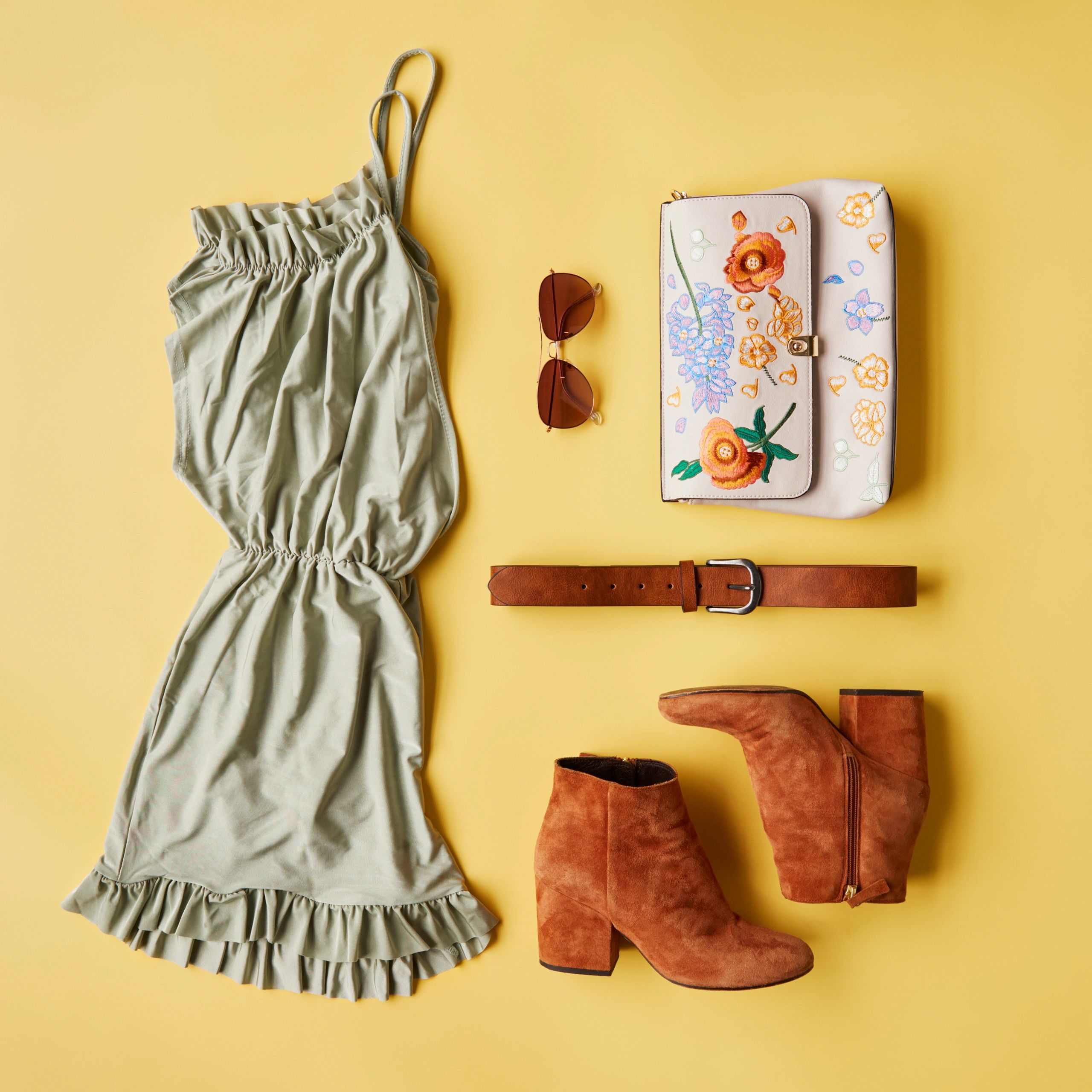 Neutral knit midi dress flat lay on warm white background